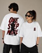 Two models wearing white oversized t-shirts with a red and black 'ONE STEP MORE' graphic. The model on the left shows the back of the shirt with a large black graphic and text, while the model on the right shows the front left-chest print of the same design.