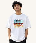 Model wearing Good Vibes oversized dusty rose graphic t-shirt by VibeVastr front view