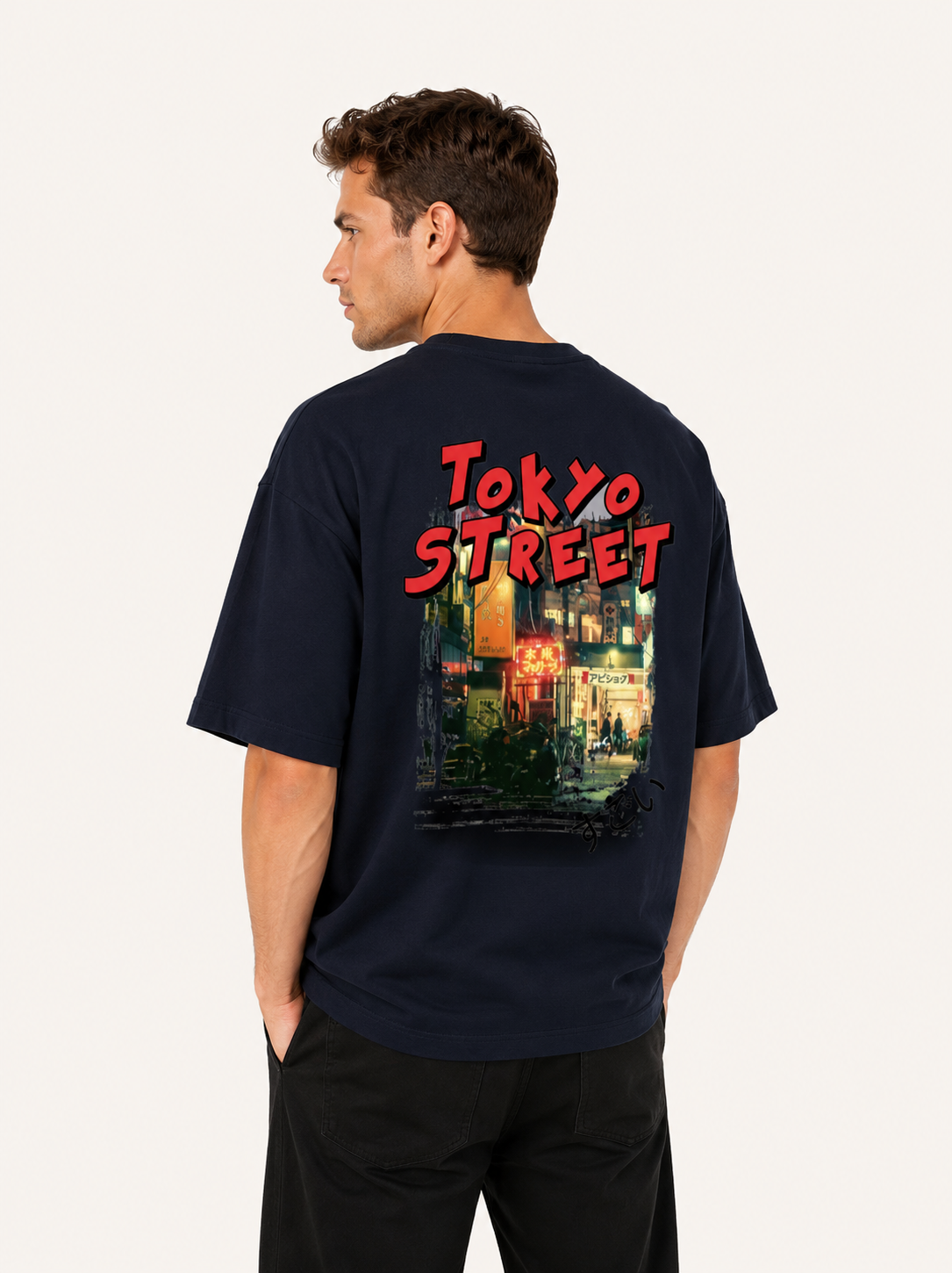 Person wearing a black t-shirt with 'Tokyo Street' design on the back