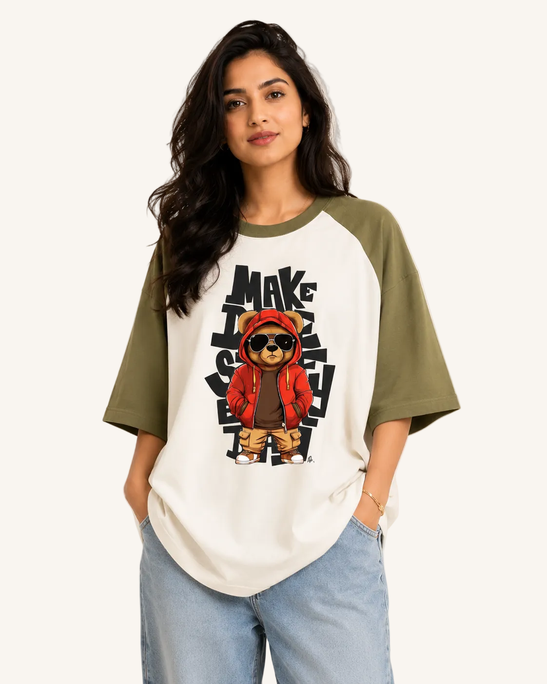 Woman wearing a t-shirt with a graphic of a bear in a red hoodie and text.