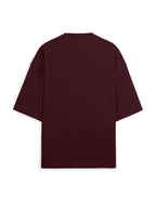 Maroon t-shirt with black text on the back against a white background