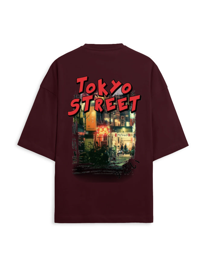 A dark maroon short-sleeve t-shirt shown from the back, featuring a large graphic print of a Tokyo street scene with red 'TOKYO STREET' text.