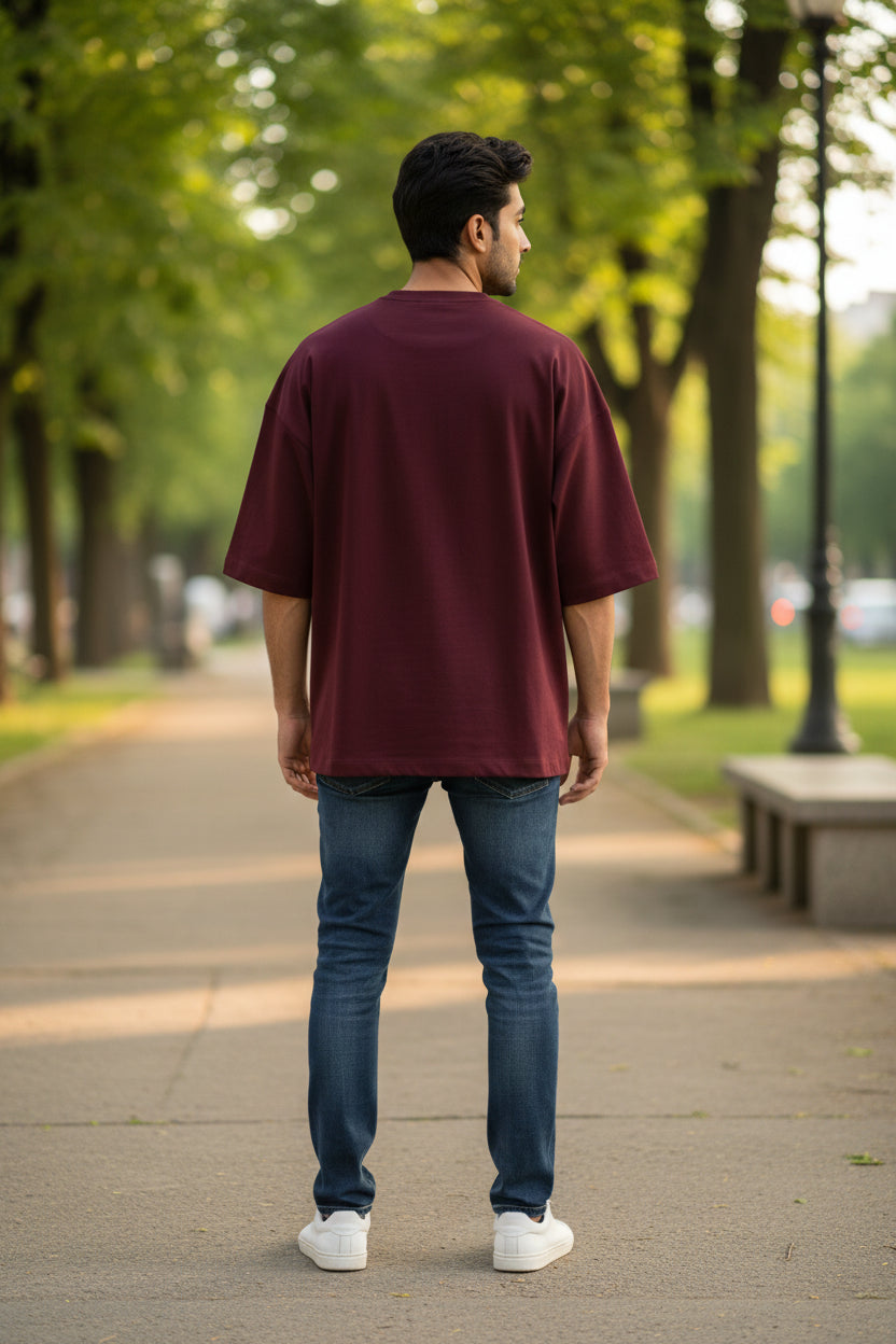 Maroon t-shirt on a beige background