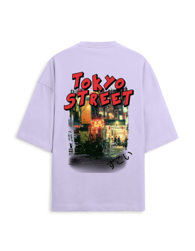A light purple short-sleeve t-shirt shown from the back, featuring a large graphic print of a Tokyo street scene with bold red 'TOKYO STREET' text.