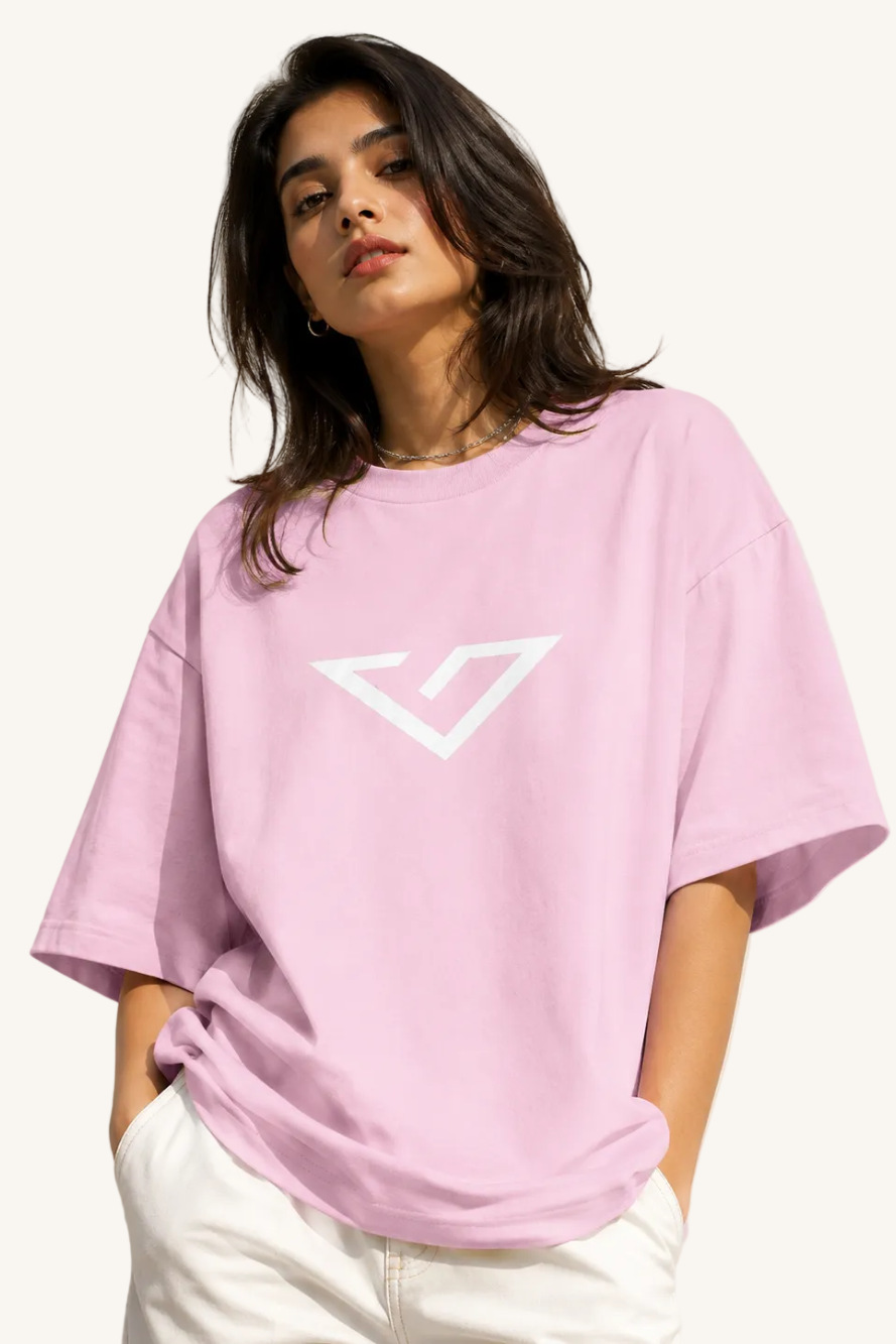 Person wearing a pink t-shirt with a logo on a plain background