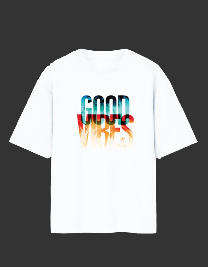 A white short-sleeve crewneck t-shirt featuring a colorful graphic print on the chest that reads 'GOOD VIBES' in a watercolor-style gradient of blue, red, and orange.