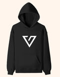 A black pullover hoodie with a white geometric triangular logo printed on the chest, displayed against a solid taupe background.