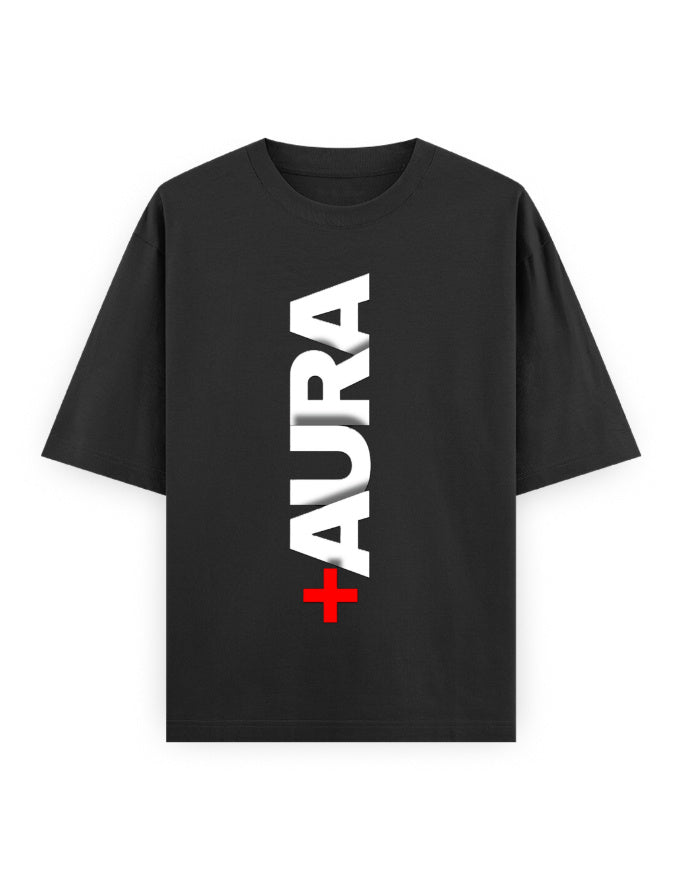 A black short-sleeve t-shirt with a vertical white 'AURA' text graphic and a red cross symbol on the front, displayed against a solid white background.