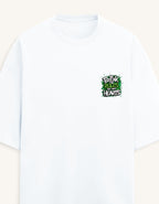 A white short-sleeve crewneck t-shirt with a small black stylized 'V' logo on the left chest, displayed against a solid taupe background.