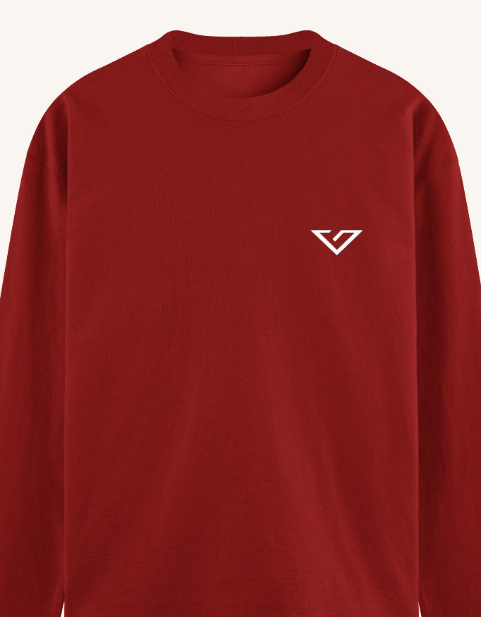 A red long-sleeve crewneck sweatshirt with a small white stylized 'V' logo on the left chest, shown against a light off-white background.