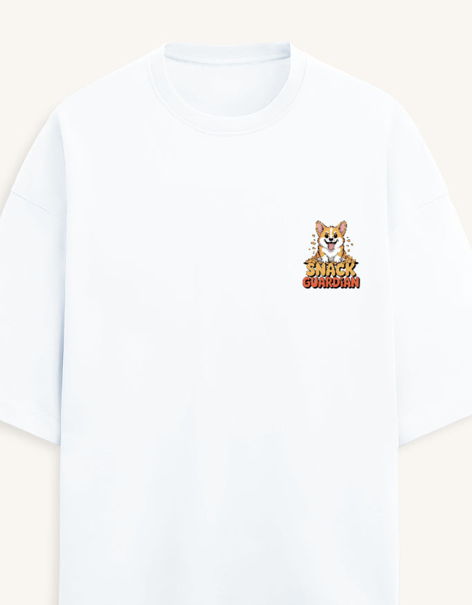 A white short-sleeve crewneck t-shirt featuring a small graphic on the left chest of a cartoon Pomeranian dog with the text 'SHARK GUARDIAN' in a stylized orange and yellow font, set against a light cream background.