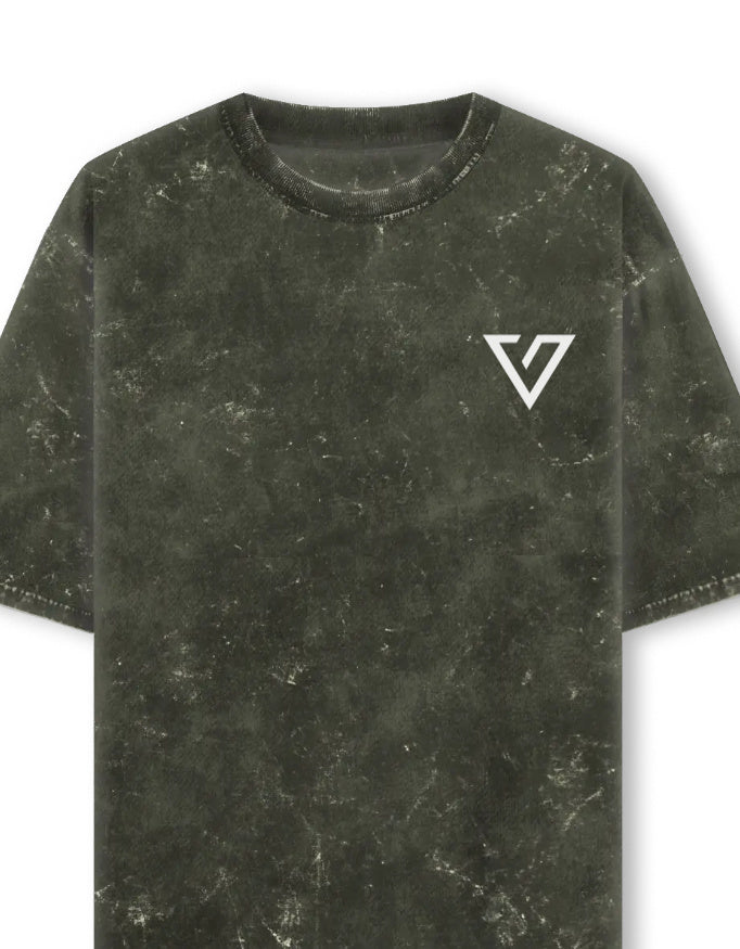 A short-sleeve crewneck t-shirt in a dark olive green mineral-wash or distressed texture, featuring a white stylized 'V' logo on the left chest, shown against a plain white background.