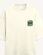An off-white crewneck t-shirt with a small graphic on the left chest that reads 'BREAK RULES WITH HEARTS' in green and black graffiti-style lettering, set against a plain light background.