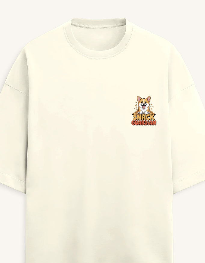 An off-white short-sleeve crewneck t-shirt featuring a small graphic on the left chest of a corgi dog above the text 'SHARK GUARDIAN' in a warm orange-yellow gradient.