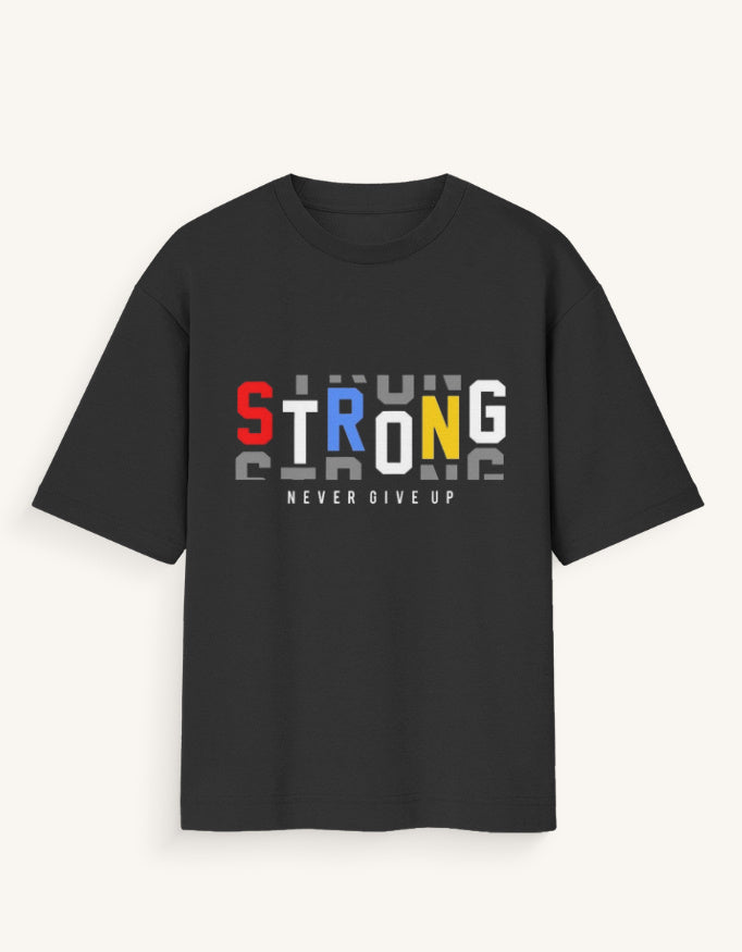 A black short-sleeve t-shirt with a graphic on the chest spelling 'STRONG' in red, blue, yellow, and white, with 'NEVER GIVE UP' printed below it, shown against a light off-white background.