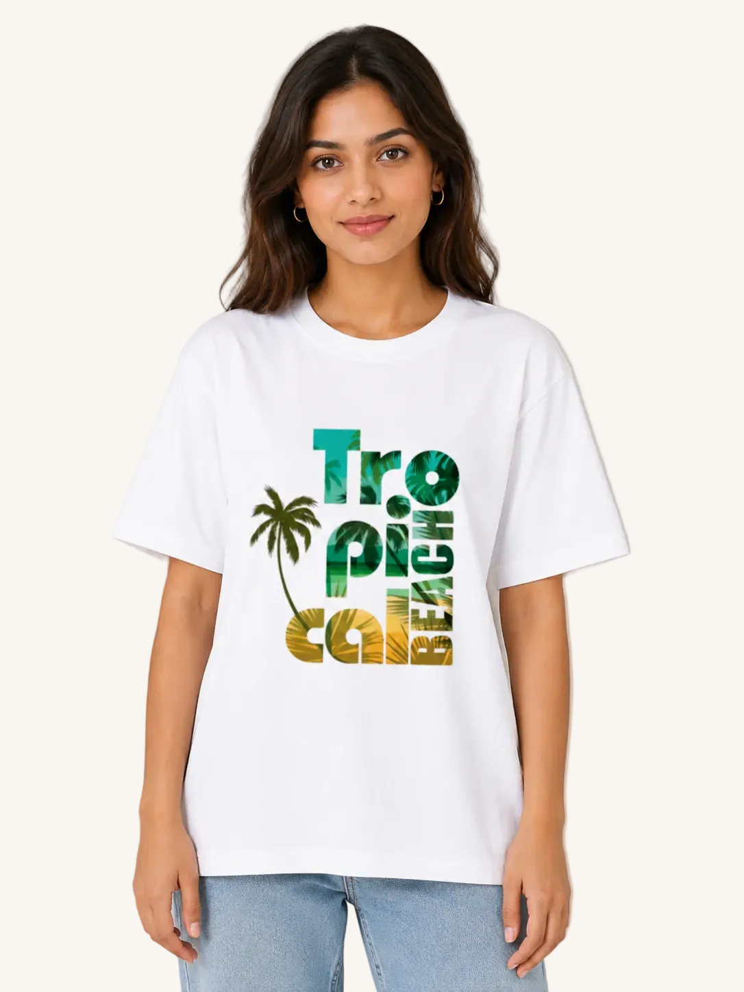 Woman wearing a white t-shirt with 'Tropical Beach' design on a beige background