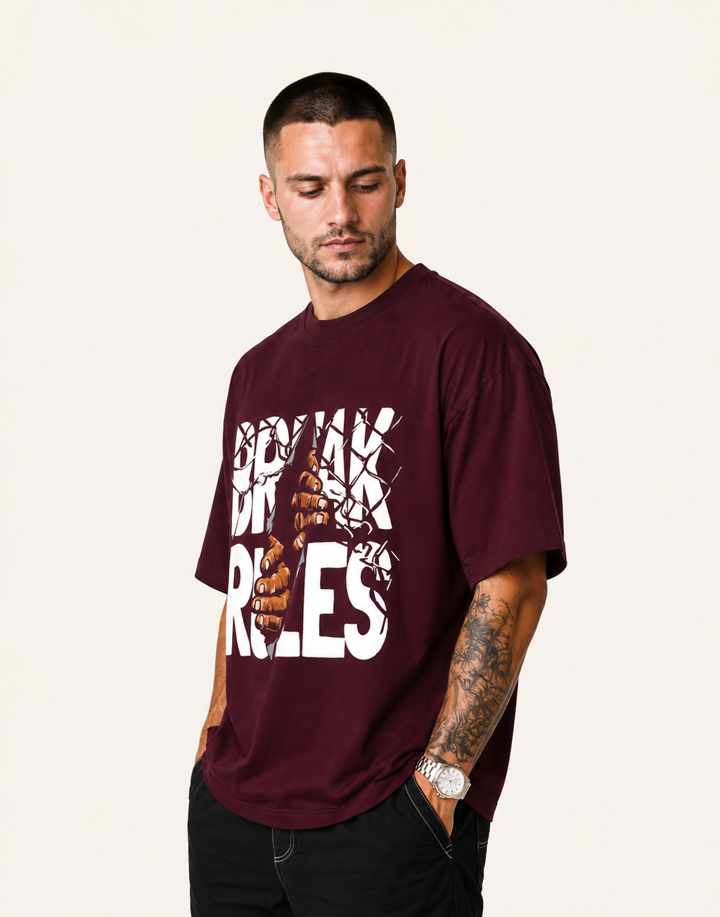 Man wearing a maroon t-shirt with graphic design and text on a white background