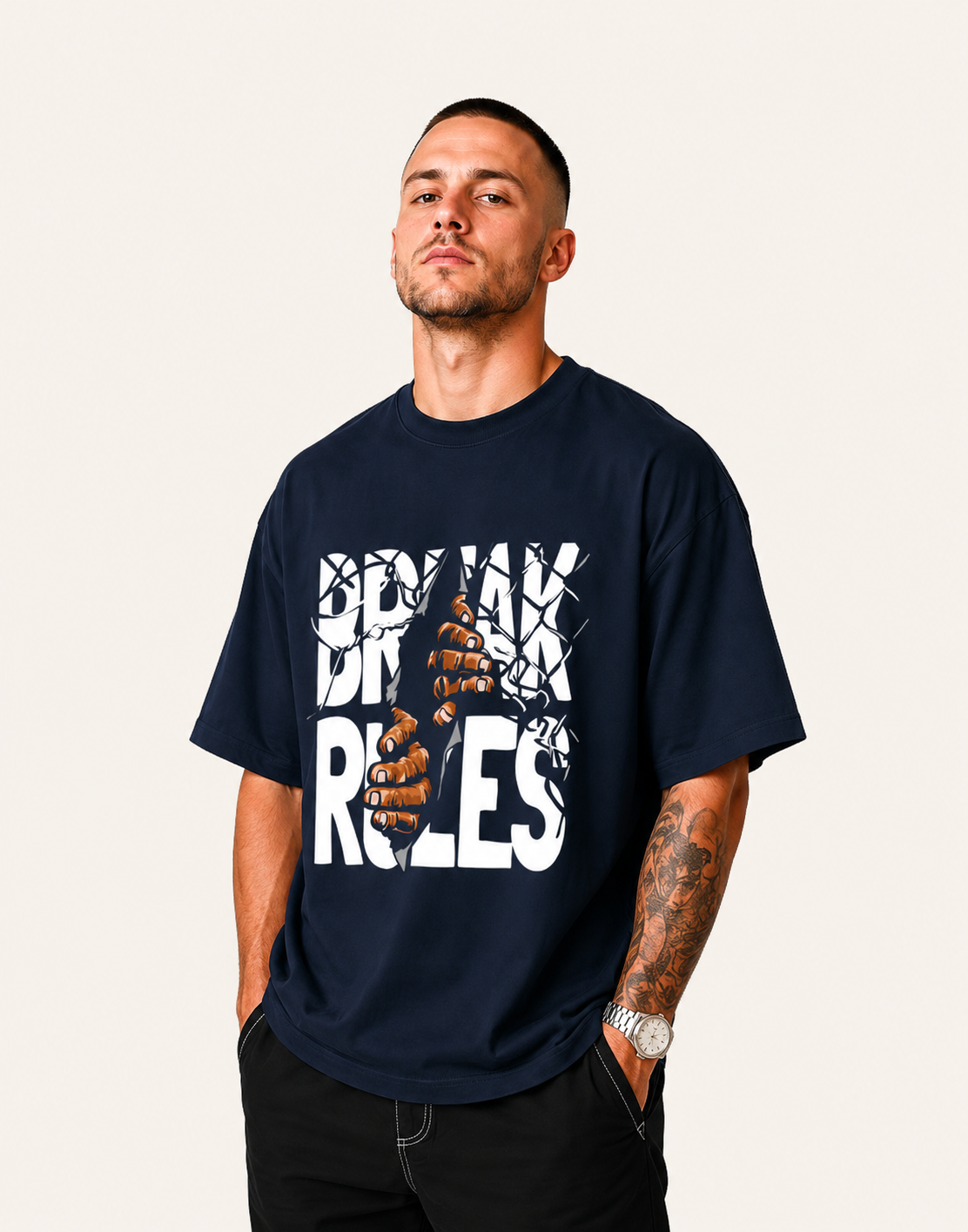 Man wearing a navy blue t-shirt with graphic design and text on a plain background