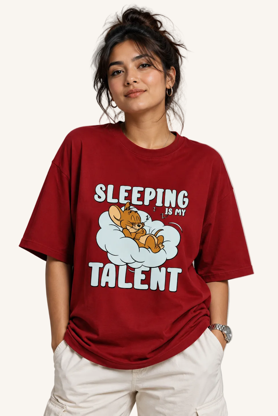 Person wearing a red t-shirt with a cartoon character and text on a plain background